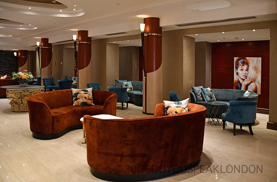 Velvet sofas in the lobby lounge of the Courthouse Hotel London