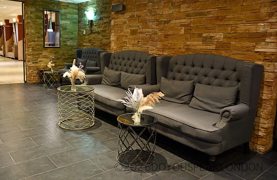 Grey sofas and stone walls in the Courthouse Hotel bar