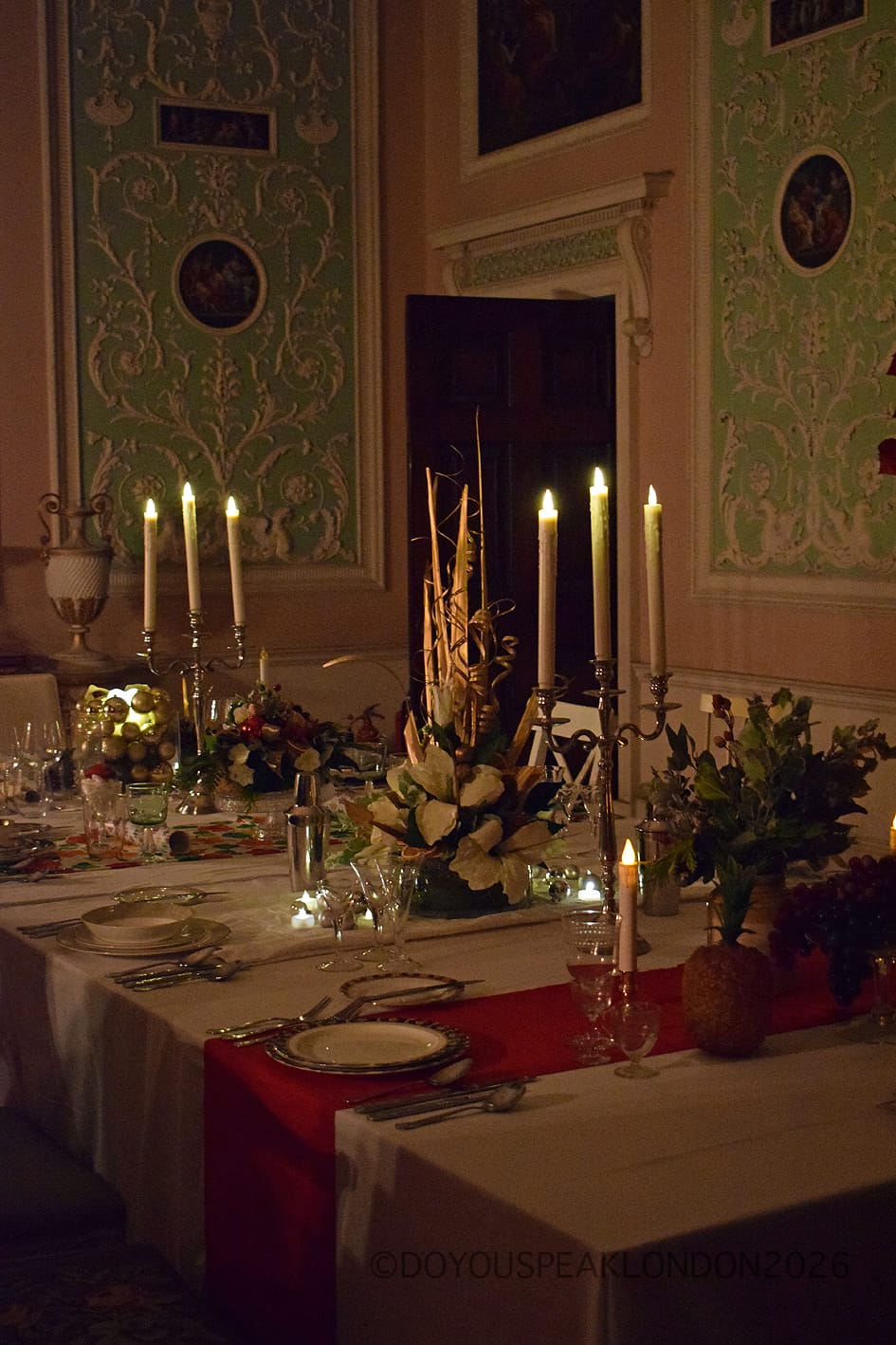 Candlelit dining table laid in the Eating Room at Osterley House