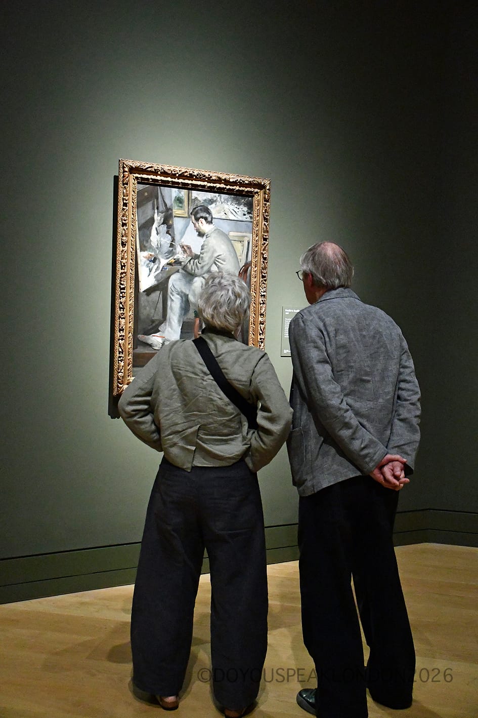 Couple looking at a Renoir painting at the Renoir and Love exhibition, London