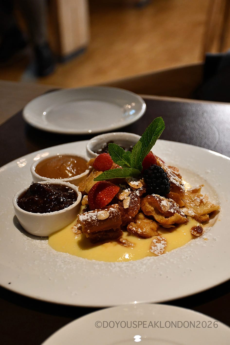 Kaiserschmarrn with apple compote, prune purée and vanilla sauce at Stein's Berlin