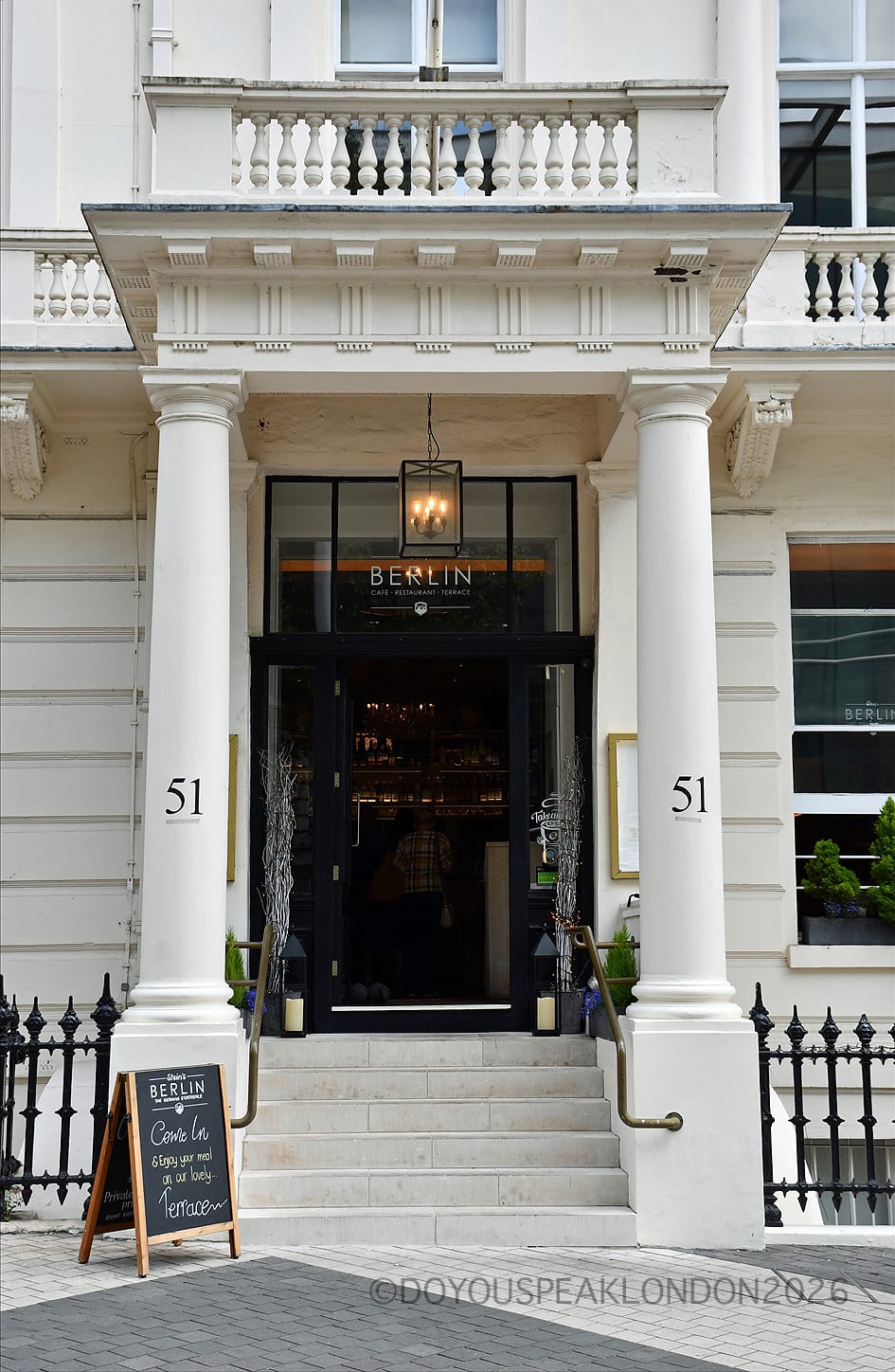 The white portico entrance of Stein's Berlin at 51 Princes Gate, South Kensington