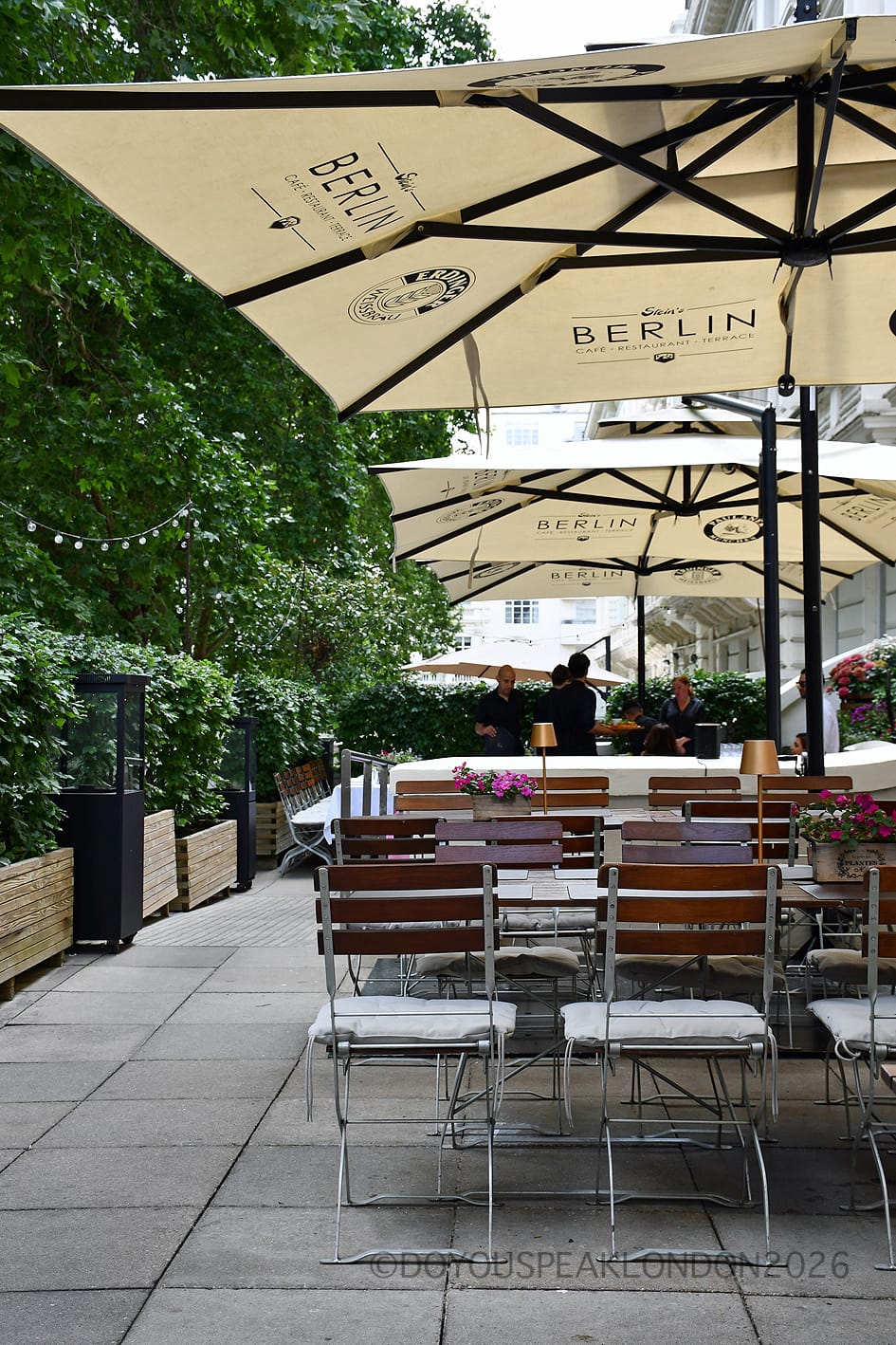 The summer terrace at Stein's Berlin with cream parasols