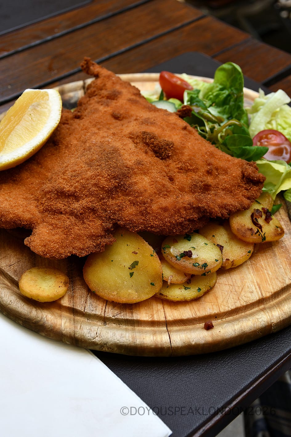 Crispy schnitzel with potato salad on the Stein's Berlin terrace