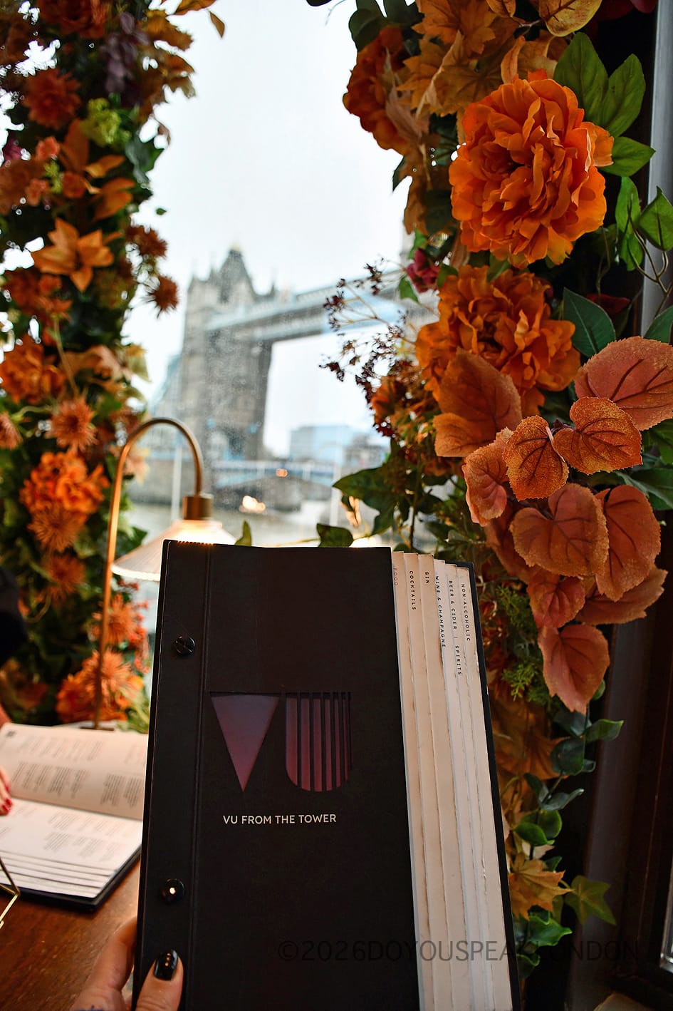 The VU from The Tower menu in front of Tower Bridge