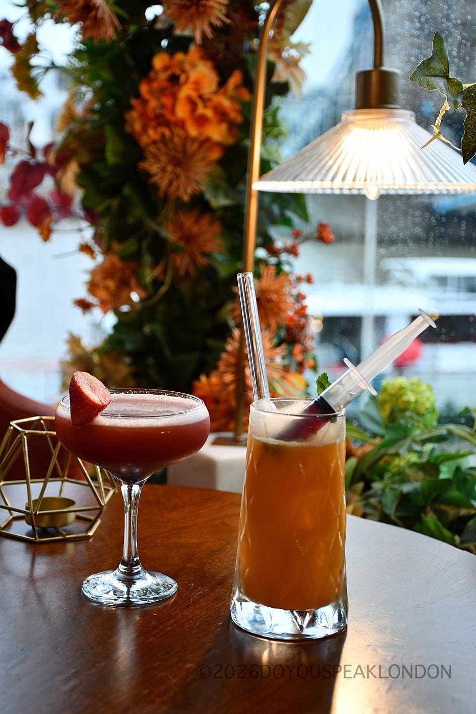 The Painkiller cocktail with its syringe at VU from The Tower