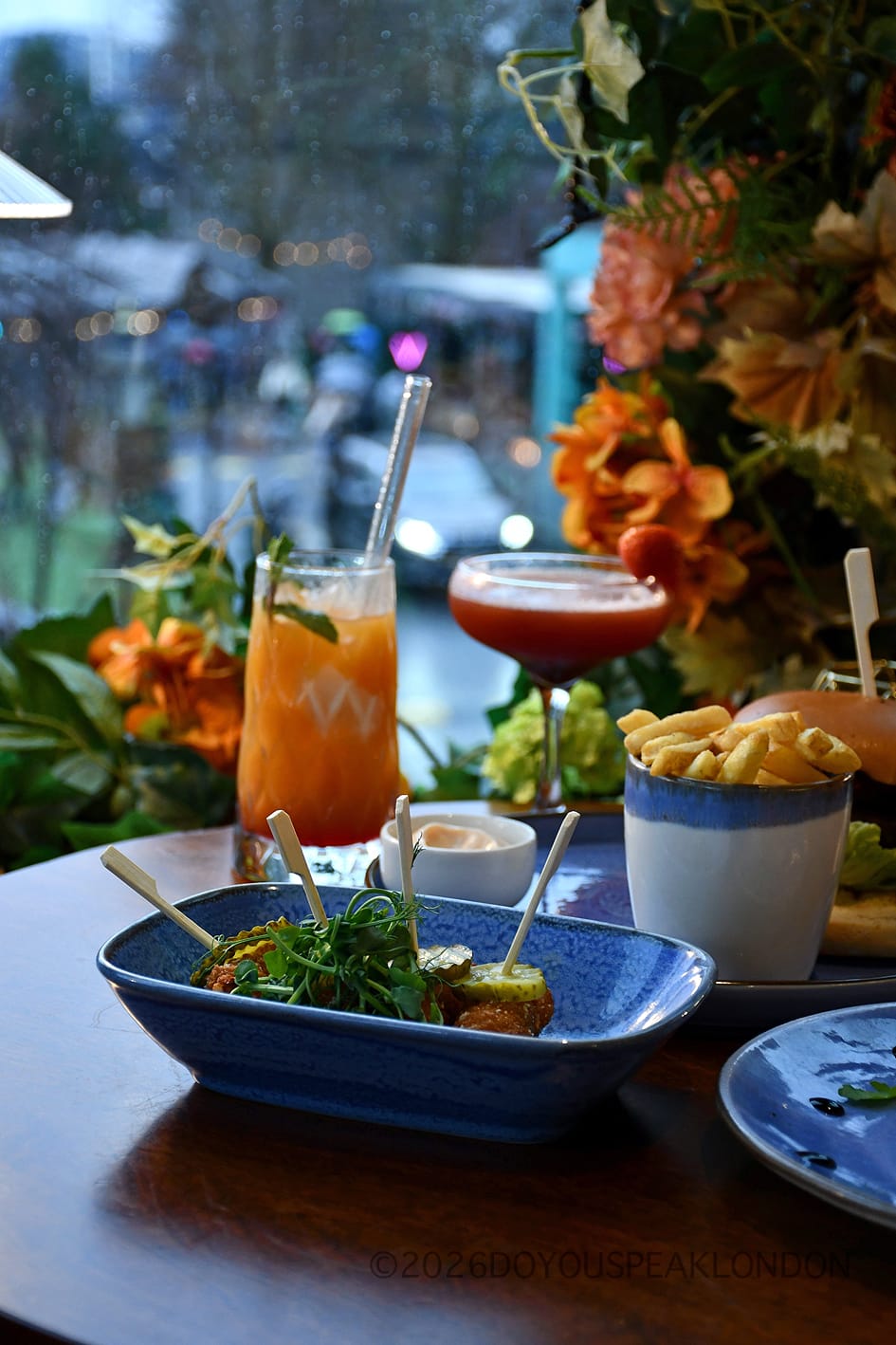 Painkiller cocktail by the rainy window at VU from The Tower