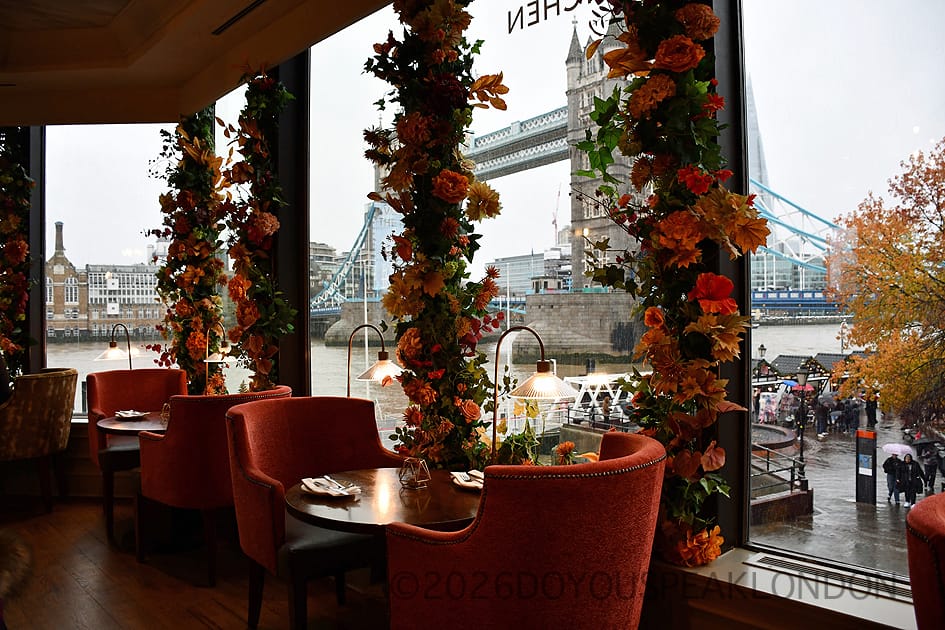 Velvet armchairs and flower-covered windows facing Tower Bridge at VU from The Tower