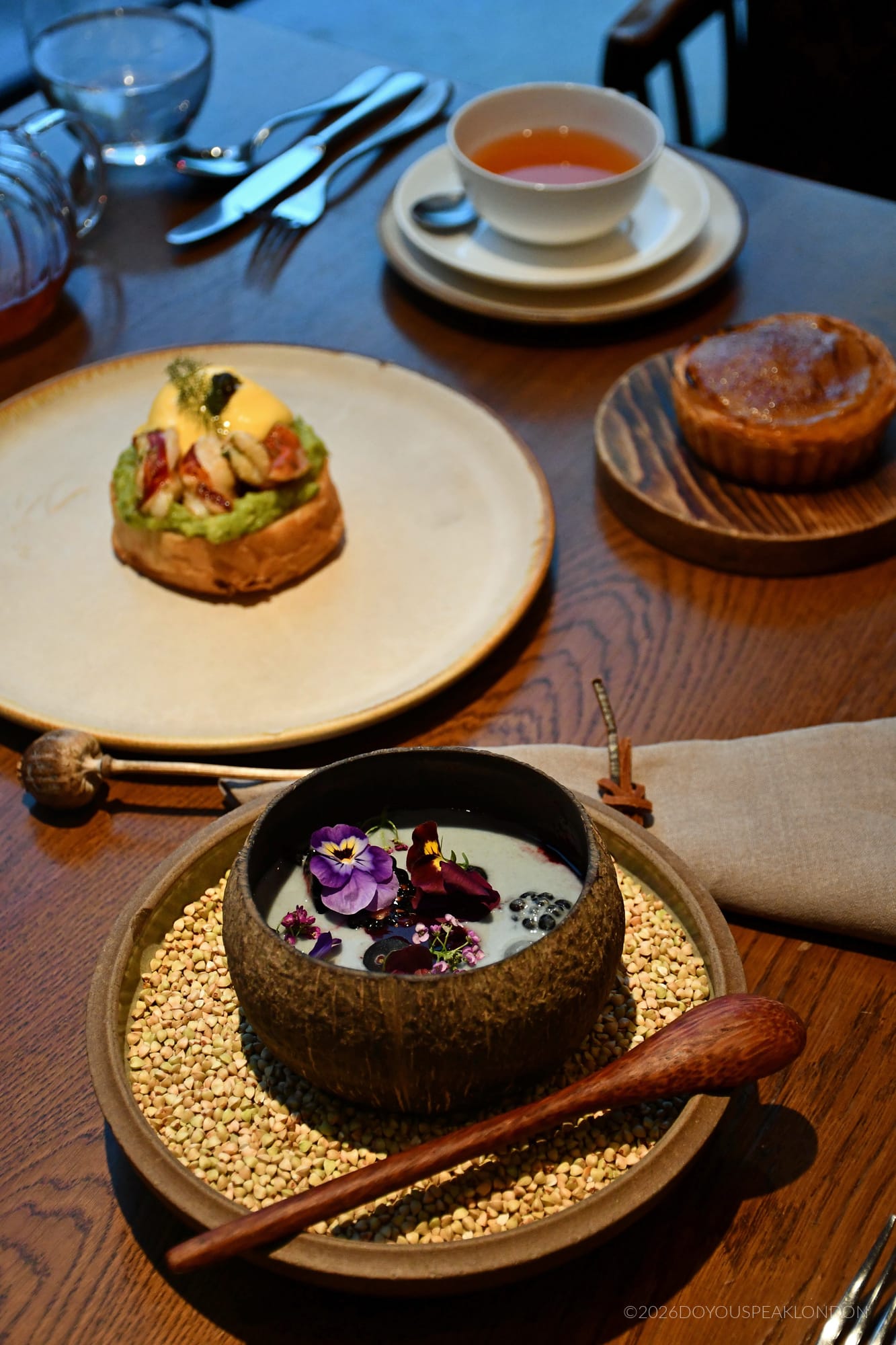 Breakfast table at HIDE with lobster benedict and acai bowl