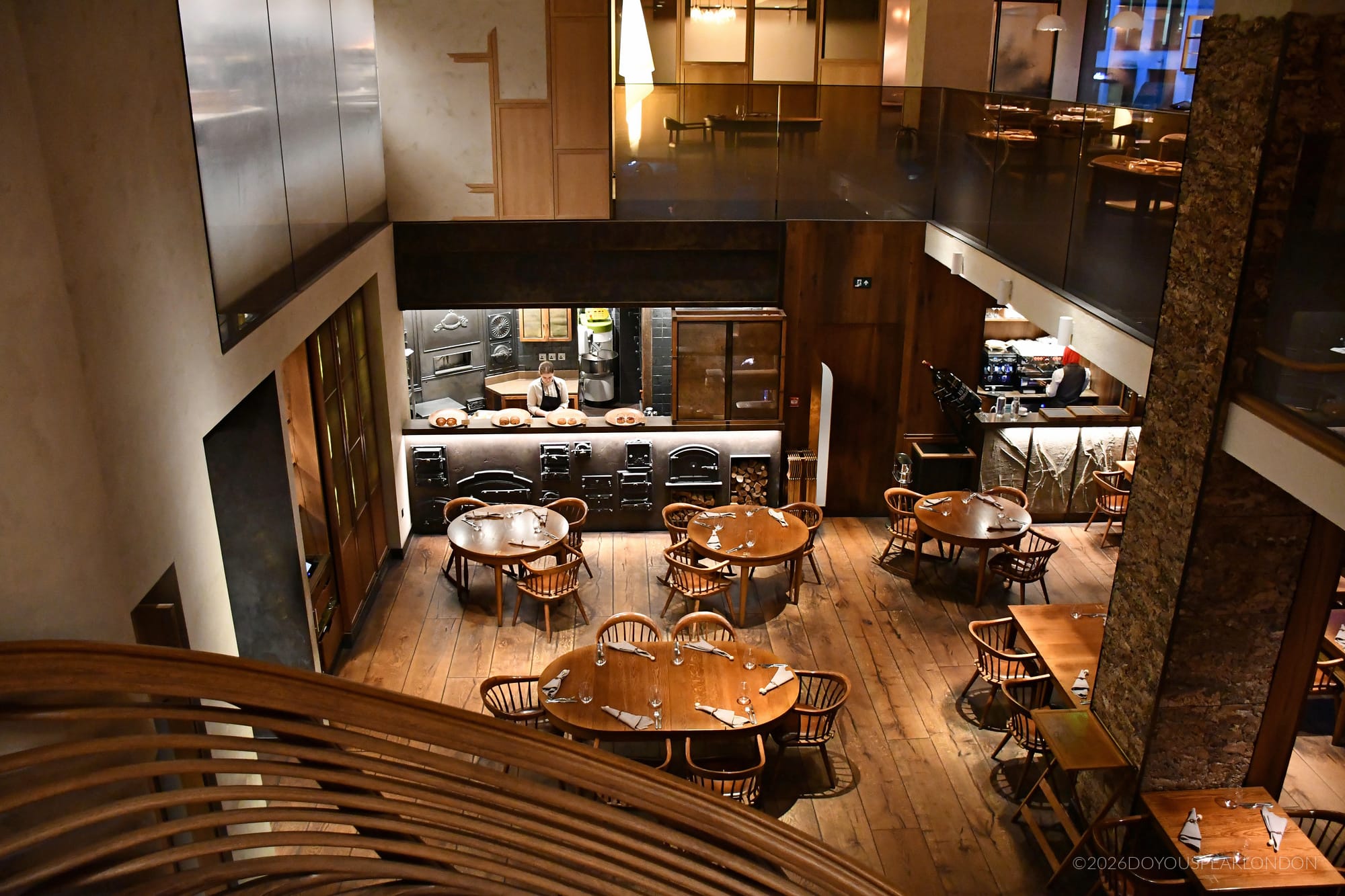 Ground-floor dining room of HIDE restaurant seen from the staircase